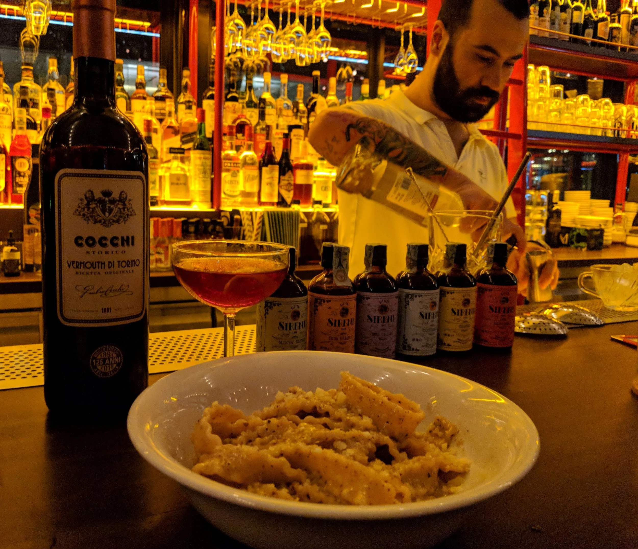 Diego uses Cocchi sweet vermouth of Torino, Liquore delle Sirene bitters and Luxardo gin in making a cocktail at Caffe Fernet