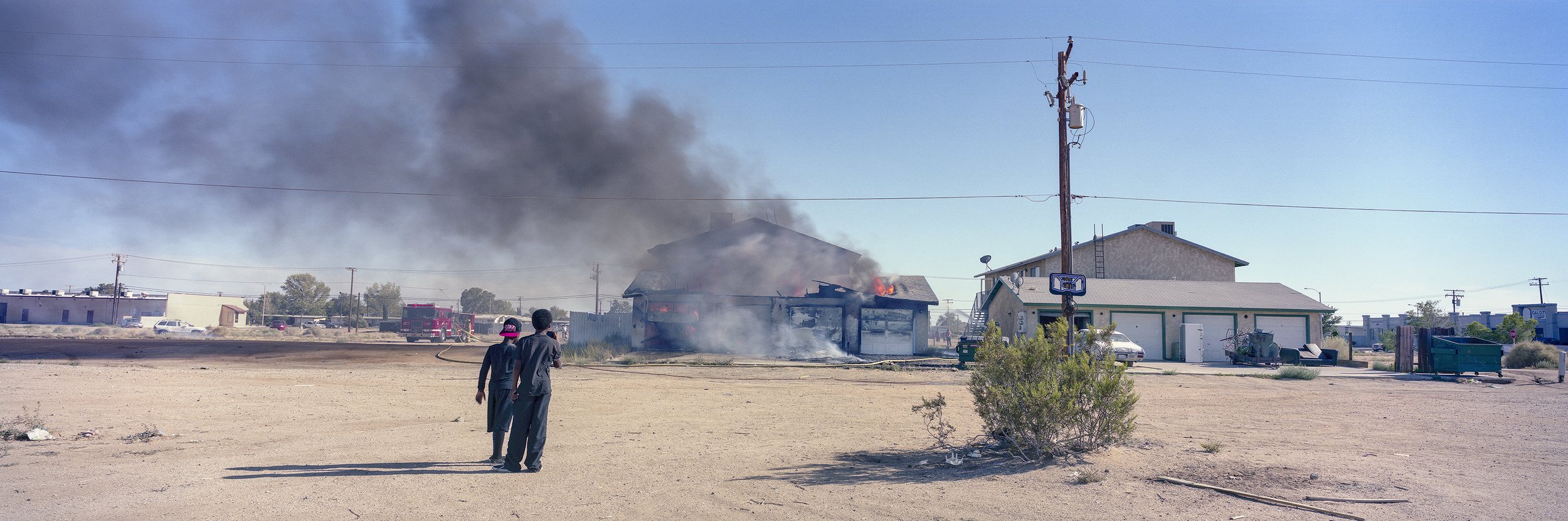   Two Boys Watching a Fire. California City. March 9, 2014  