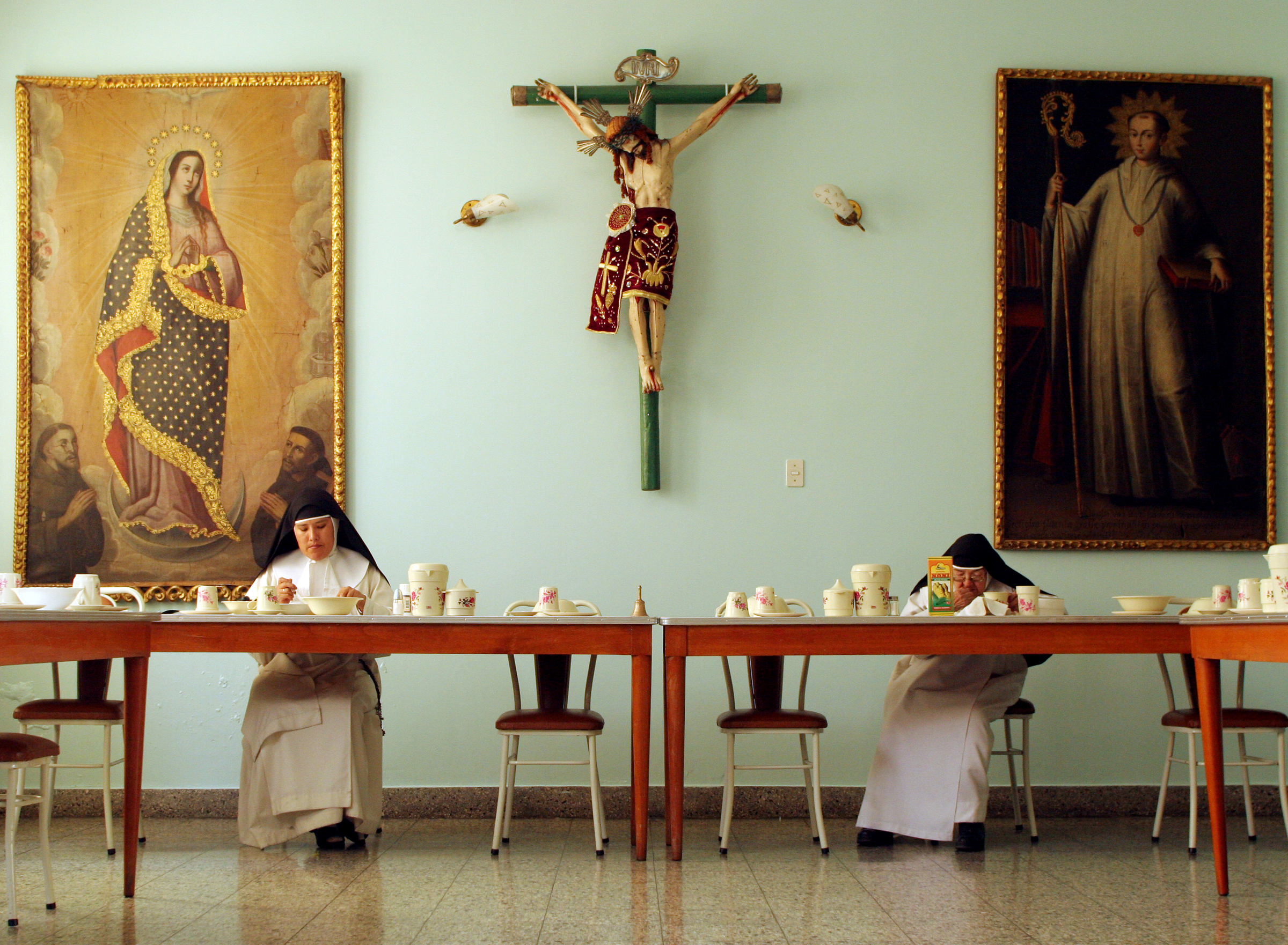  Sister Consuelo, right, eats breakfast every day at 8:15 a.m., after waking up at 5 a.m. and attending the morning prayer and daily Mass. As a cloistered nun, each hour of her day is devoted to Christ; the nuns meditate and think about God even duri