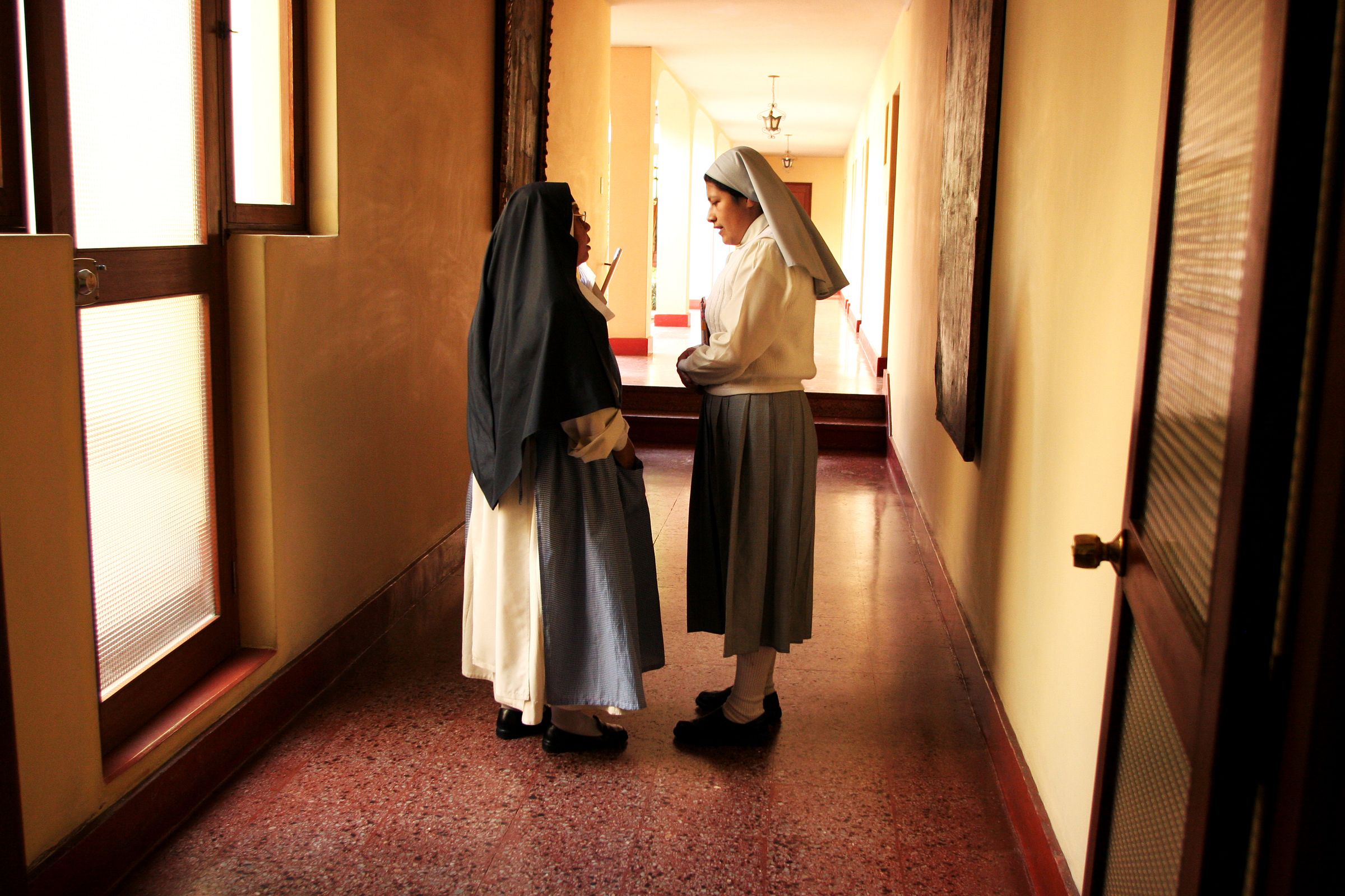  Sister Heidi stops to ask Mother Superior Isabel a question. There are several stages to becoming a Dominican nun; after initial inquiry, where the candidate communicates with one of the nuns from her home in order to decide whether becoming a nun i