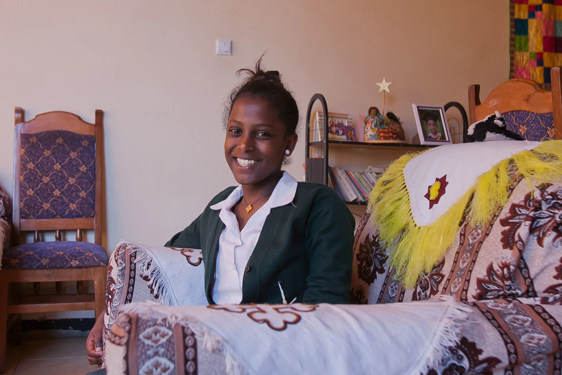Tizita poses in her home at Gondar house.
