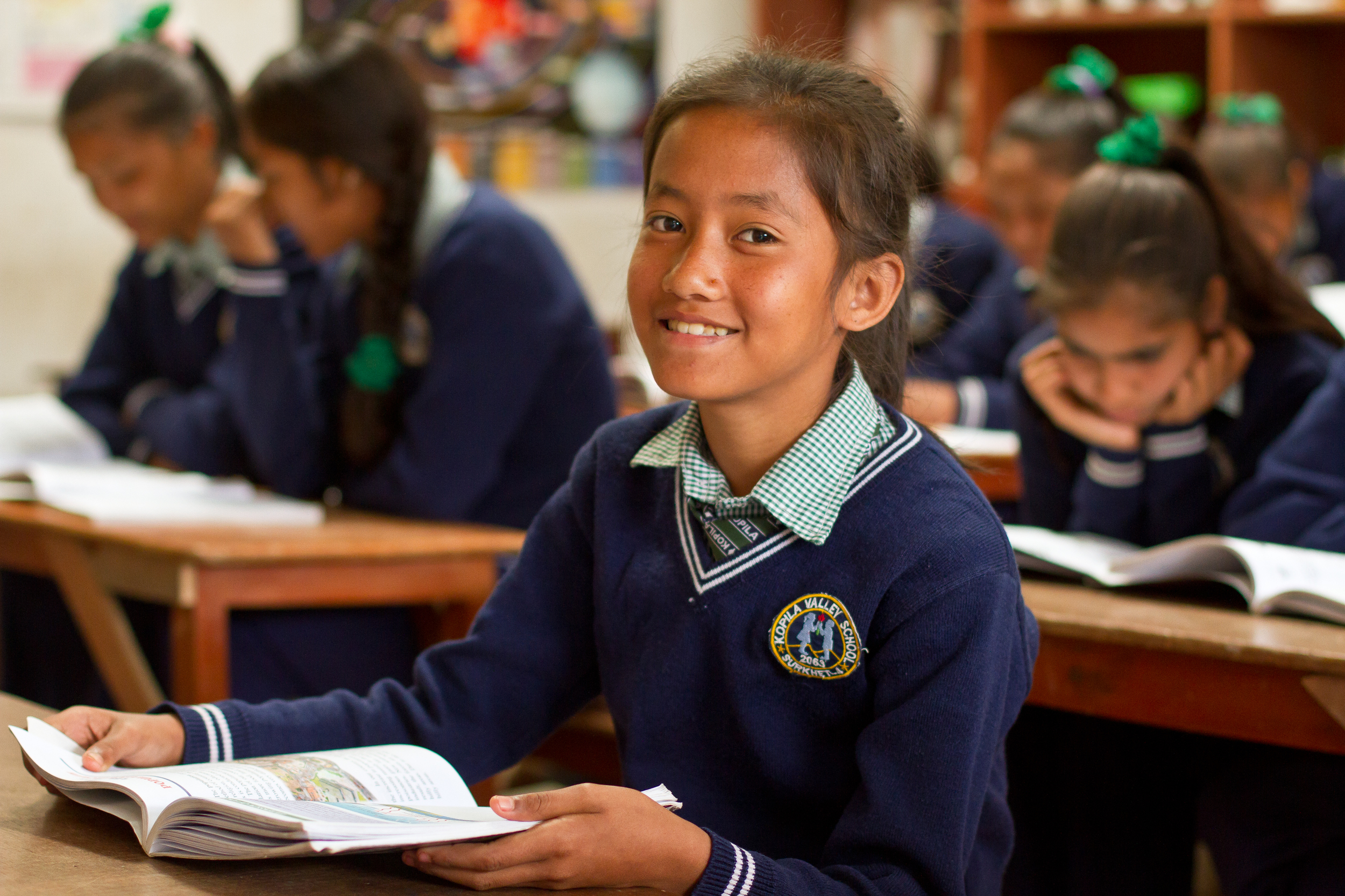  She's the First Scholar and sixth grader Supeksha G. poses in her school's science classroom in Nepal, March 2015. (photo by Kate Lord) 