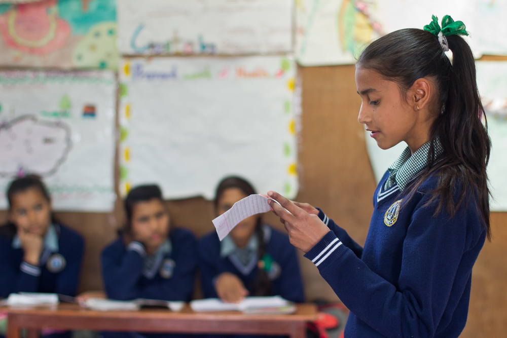  She's the First Scholar Apeksha K. presents to her eighth grade class in Nepal, March 2015. (photo by Kate Lord) 