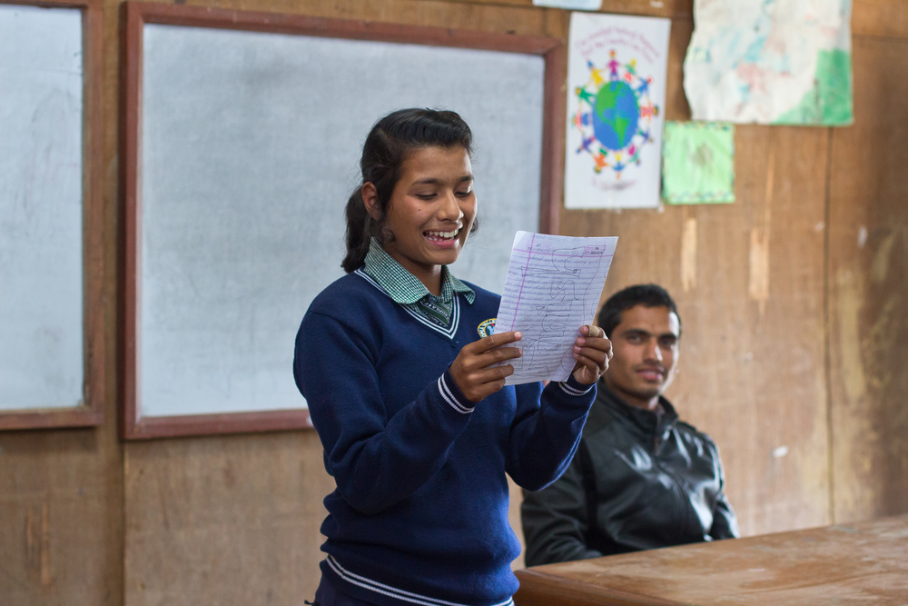  She's the First Scholar Kamala S. presents to her eighth grade class in Nepal, March 2015. (photo by Kate Lord) 
