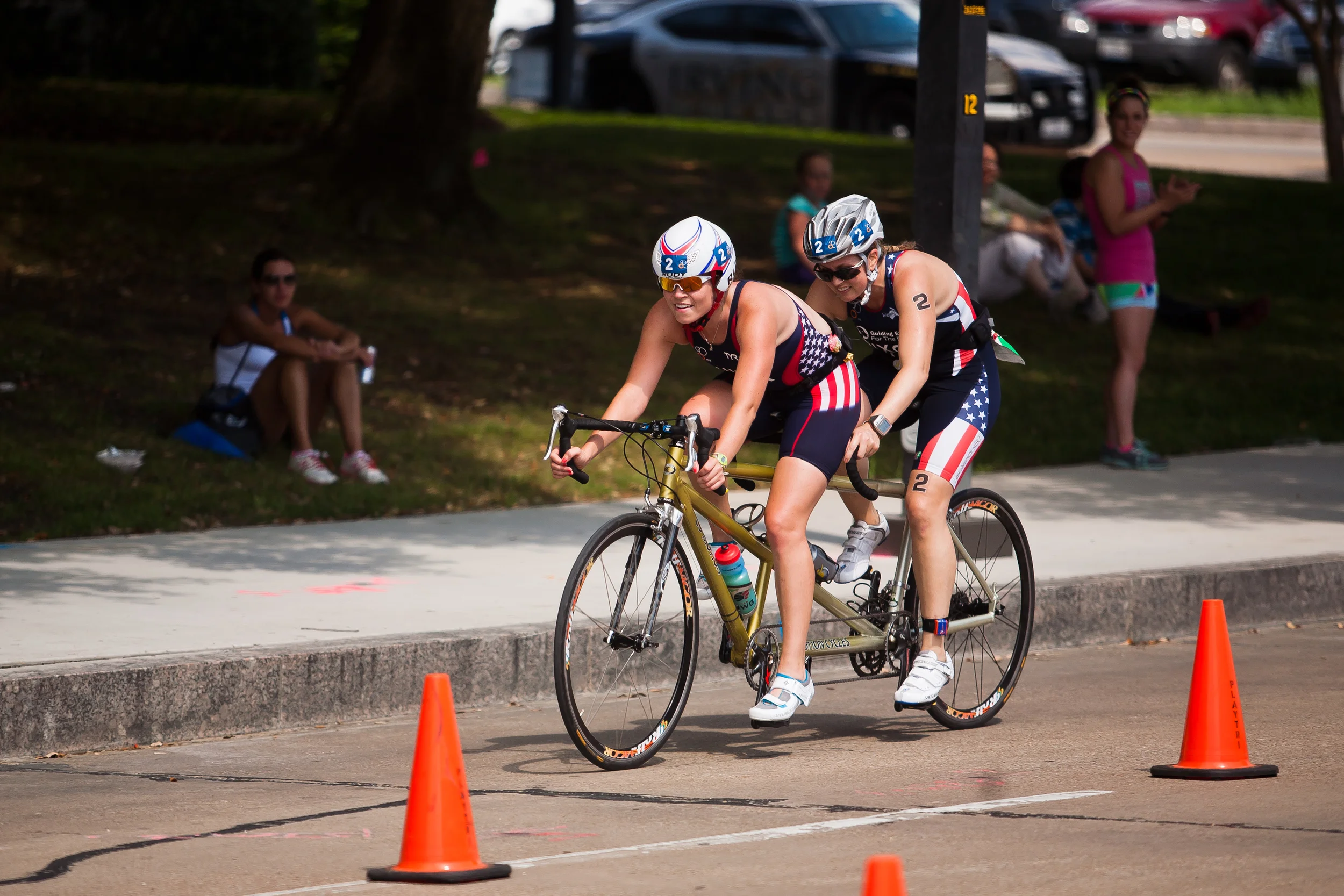  Amy Dixon (right), a visually impaired sommelier and triathlete, competes in the biking portion of the 2014 Dallas Panamerican Triathlon Confederation (PATCO) Triathlon Pan American Championships with her guide Caroline Gaynor, co-triathlon director