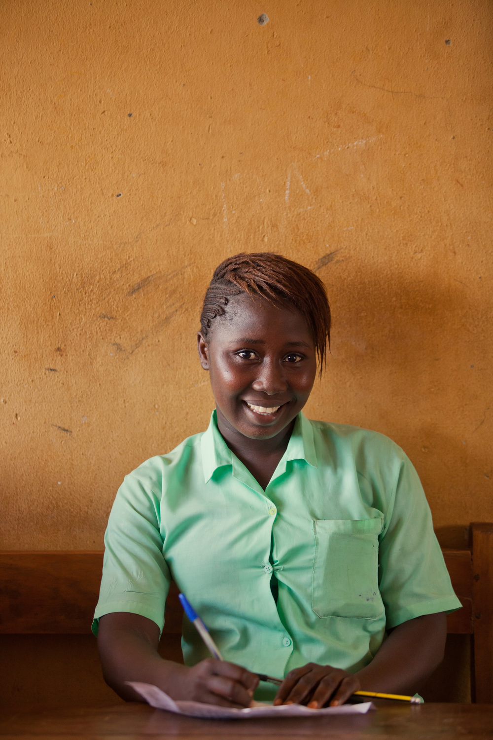  Isha's f amily was displaced by the war in Sierra Leone soon after she was born, and they had to leave their support network behind them. When Ebola hit the country last year, it claimed both of her parents. Isha, 15, is quick to smile and gets good