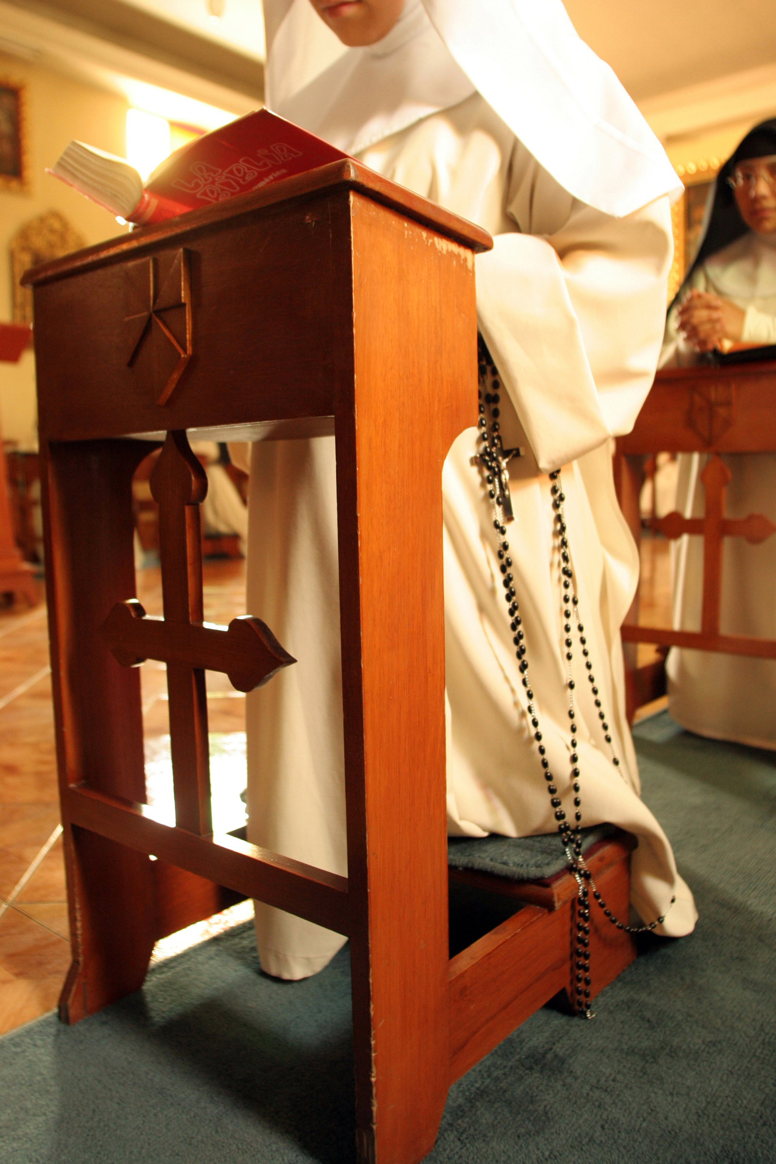  Novice nuns pray in a private chapel within the living quarters of the monastery. 