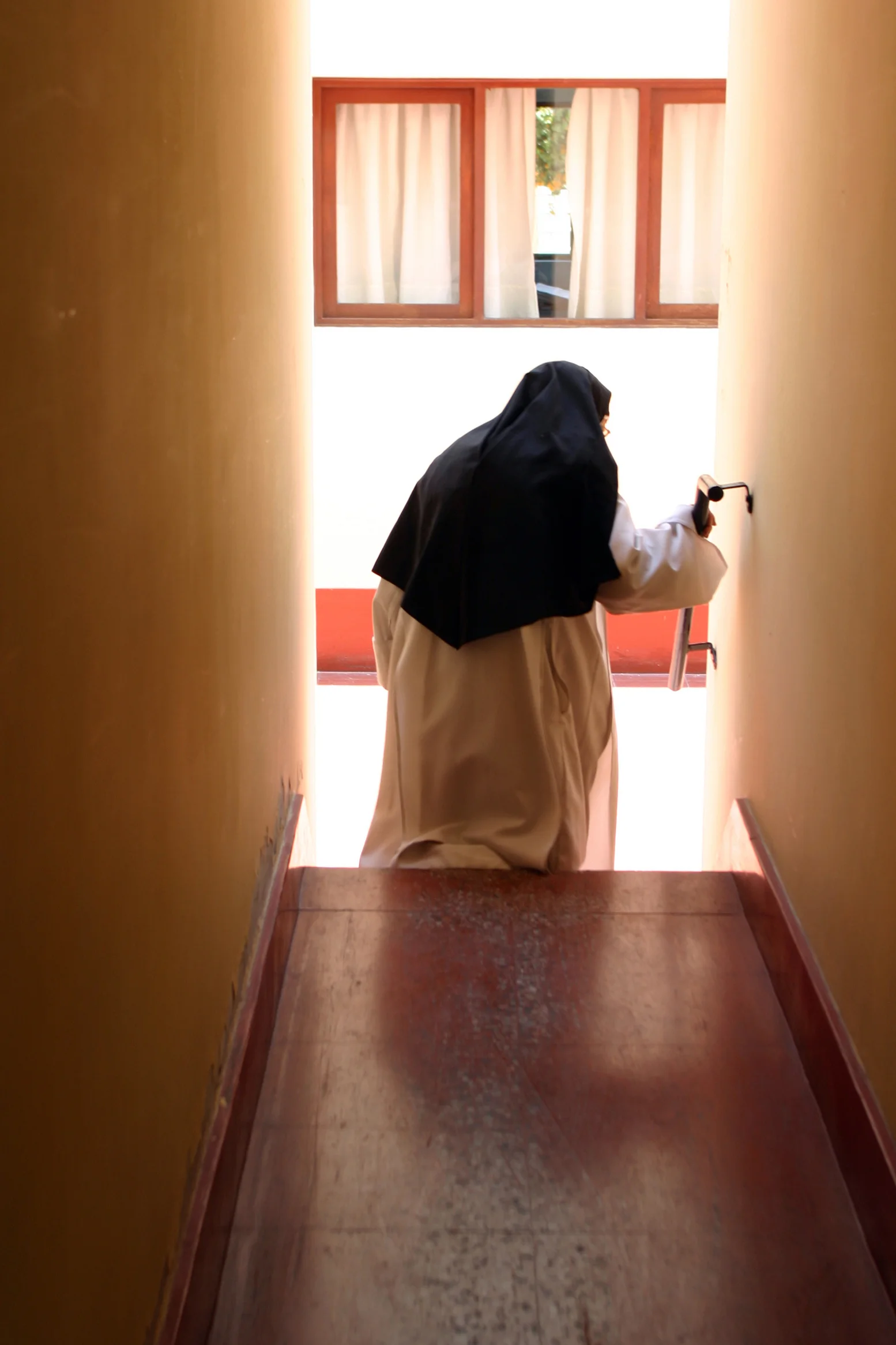  Sister Consuelo walks toward the monastery's chapel. 