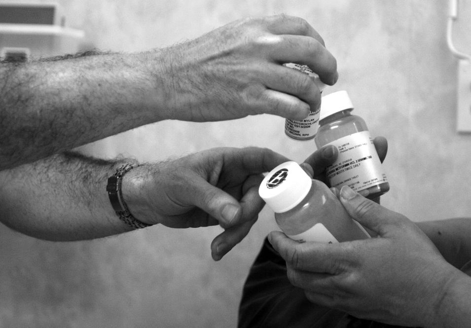 Dr. Stover returns a patient’s medications after reviewing the dosages to ensure they are correct. Stover said that the majority of what is down at the clinic is to make sure that the patients are keeping up with their medications and that they can receive them for a decent price.
