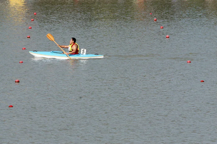 Shen Weiguo, 28, of China competes in the division seven 500 meter kayaking final at Shanghai Aquatic Sports Center.