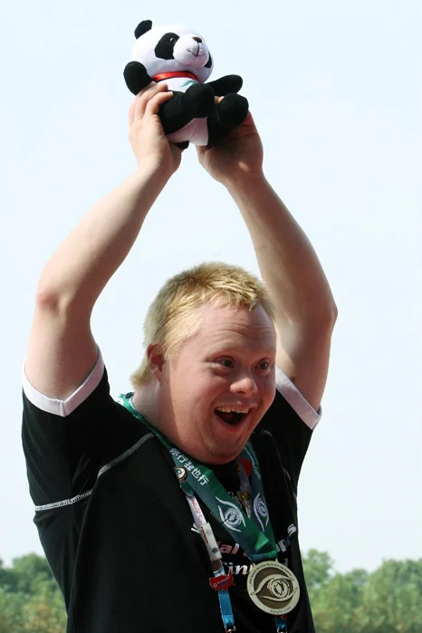 IIpo Holttinen, 29, of Finland celebrates his bronze medal in the 500 meter division nine kayaking finals during the 2007 Special Olympic World Summer Games at Shanghai Aquatic Sports Center.