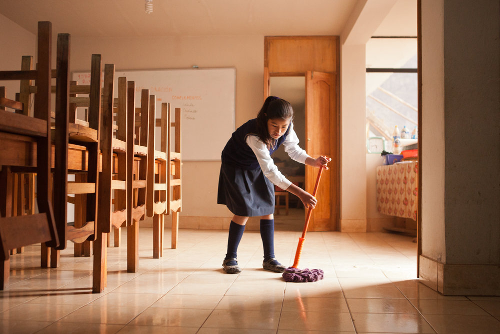  Flor Nayda's assigned chore this morning is mopping the kitchen. 