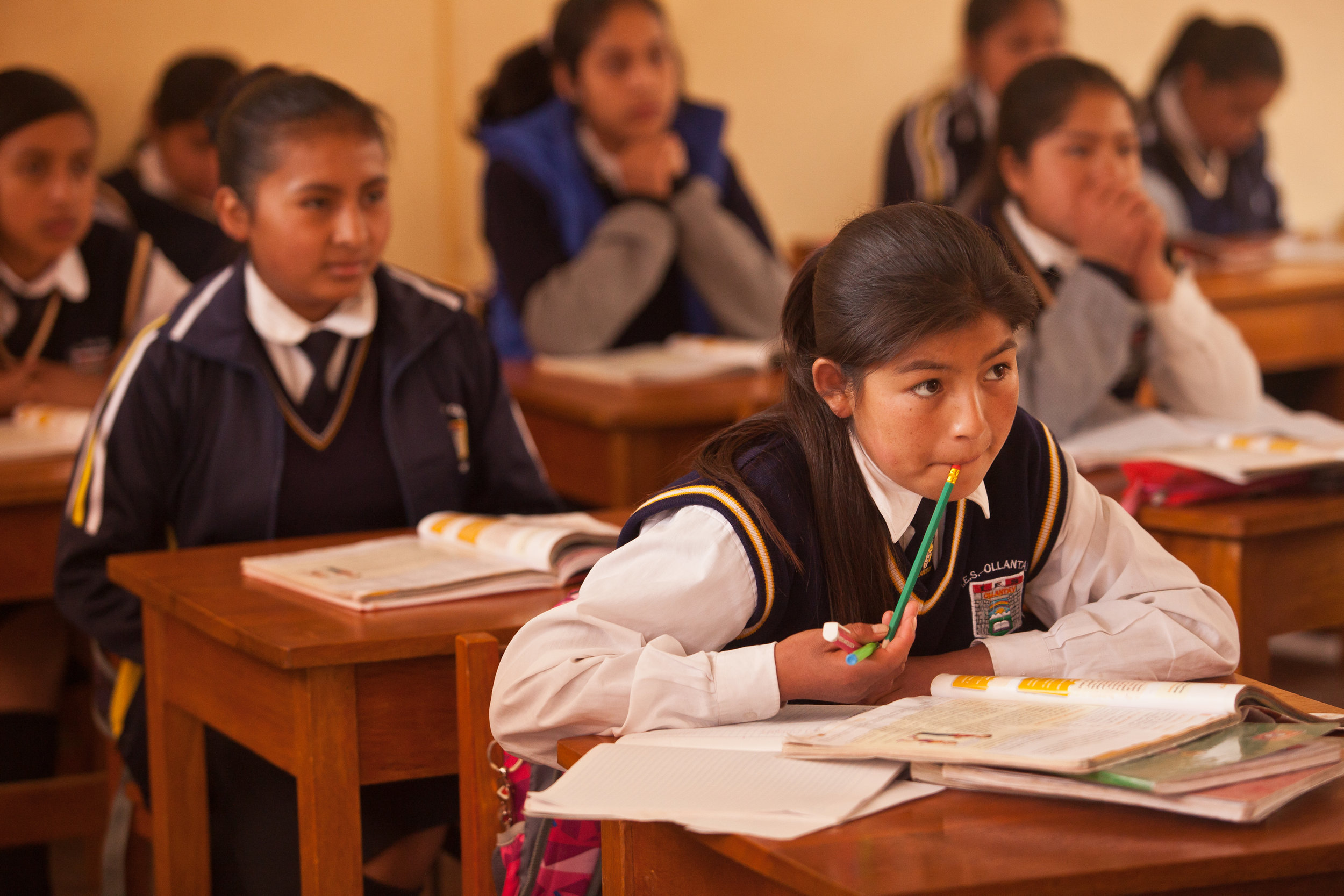  Yessenia listens in class -- she receives a scholarship from She's the First that covers both her tuition fees and all the costs involved with living with Sacred Valley Project - room & board, house mothers, mentorship, tutoring sessions and leaders