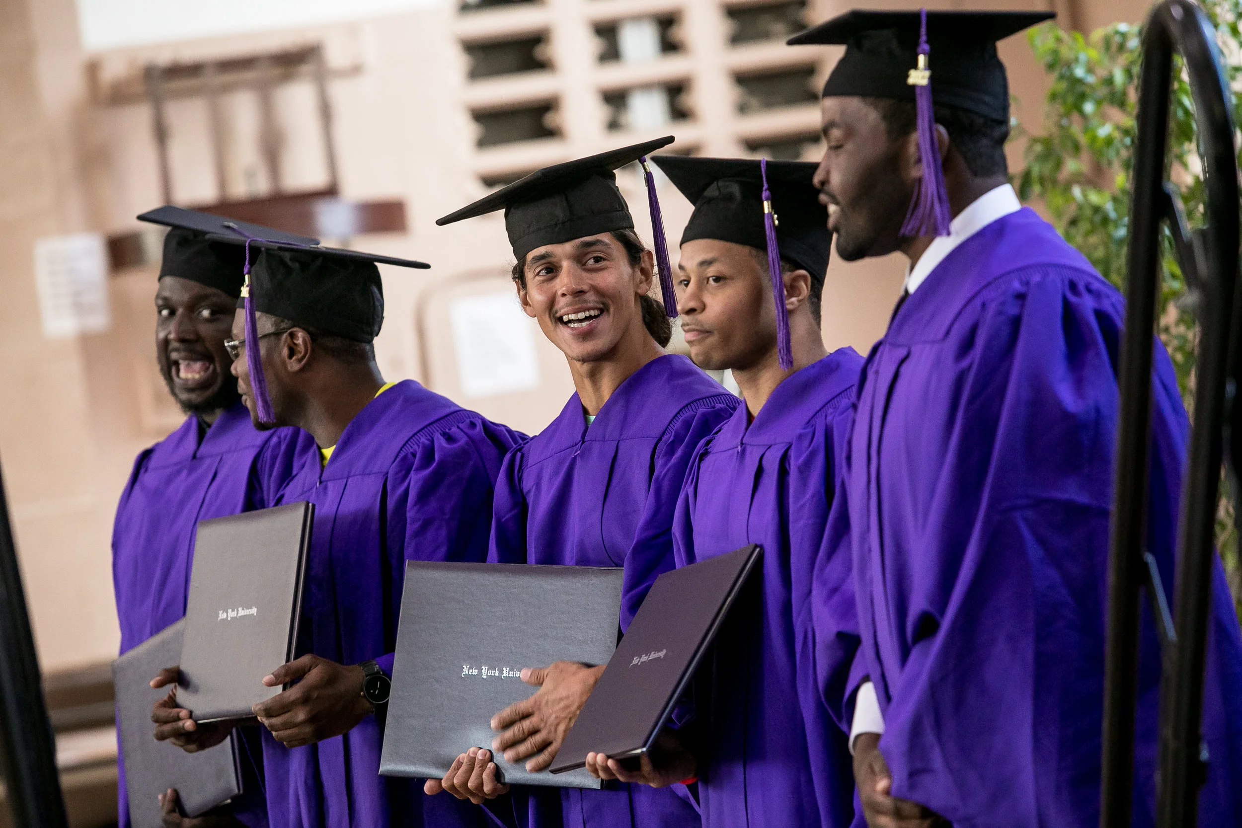 Graduate Danis Flores proudly displays his diploma after walking the stage.