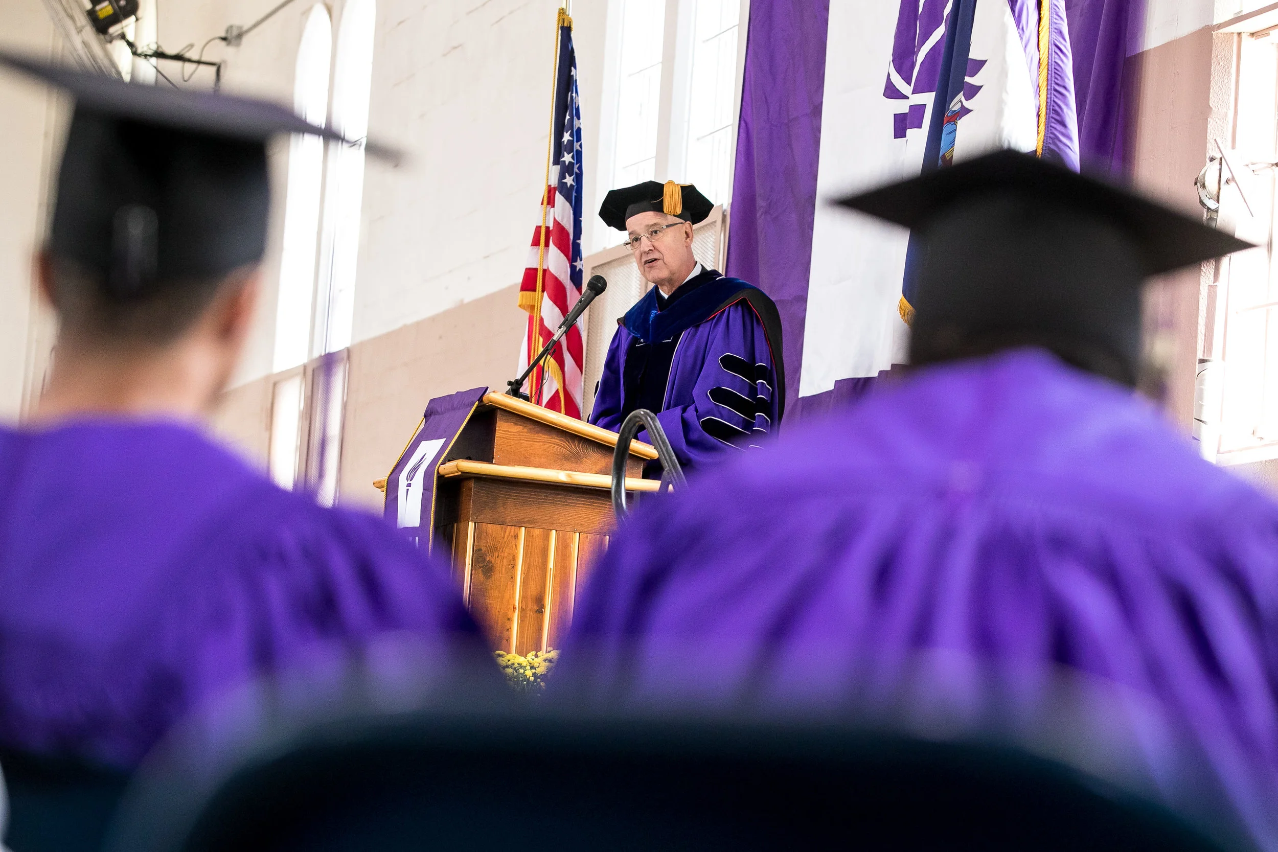 New York University President Andrew Hamilton makes his address.