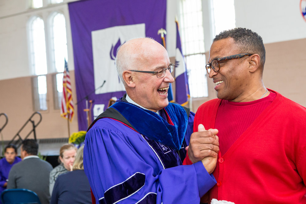  New York University President Andrew Hamilton chats with Anthony Stevens, a current student in the NYU Prison Education Program. 