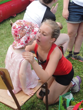 Claire hard at work face painting.
