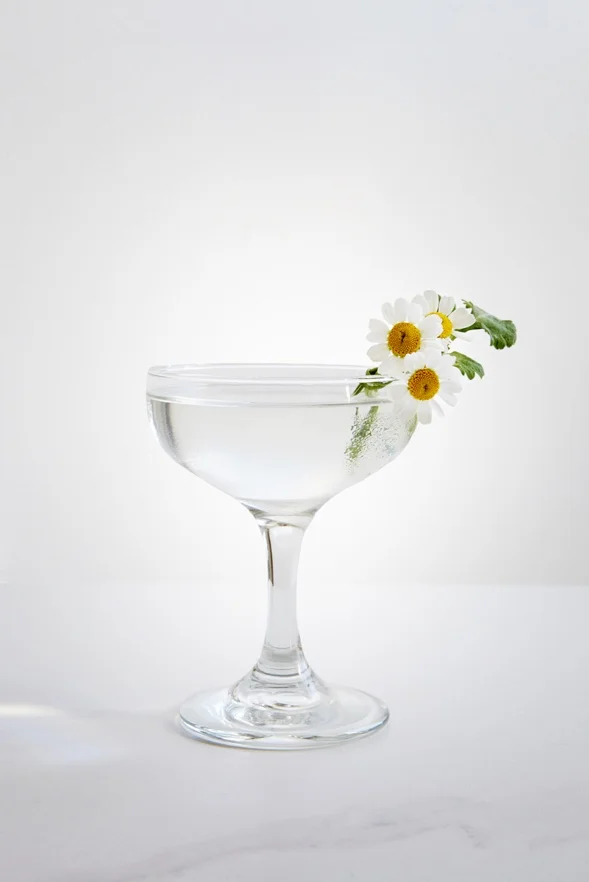 MARY ASTOR 2 oz Gin 3/4 oz Chareau 1/2 oz Lillet Blanc Stir ingredients over ice. Strain into coupe and garnish with edible flowers. Cocktail by Pablo Moix