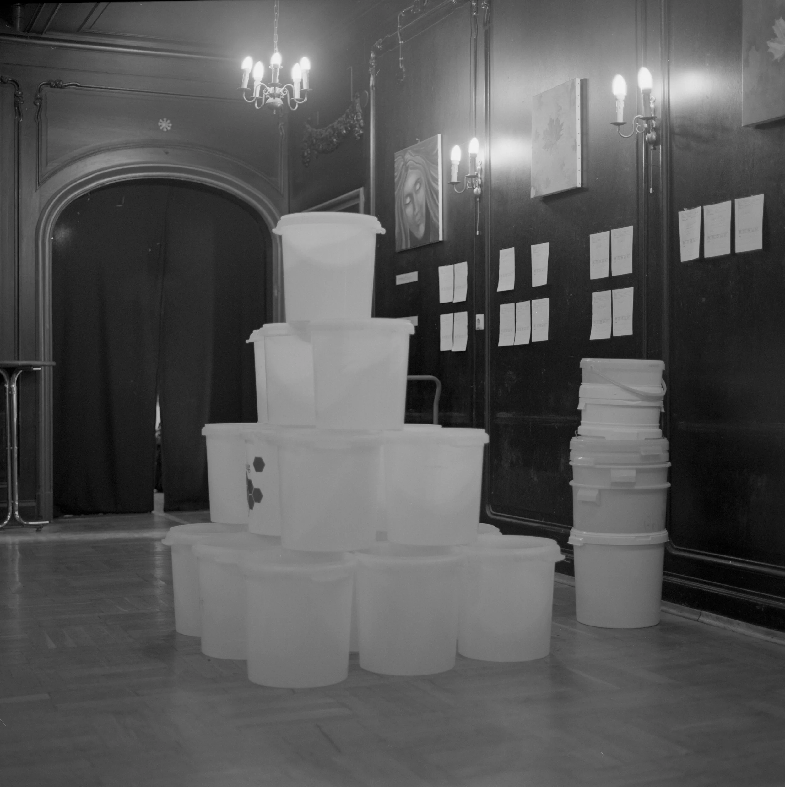 Honny buckets sre stored in the hallway