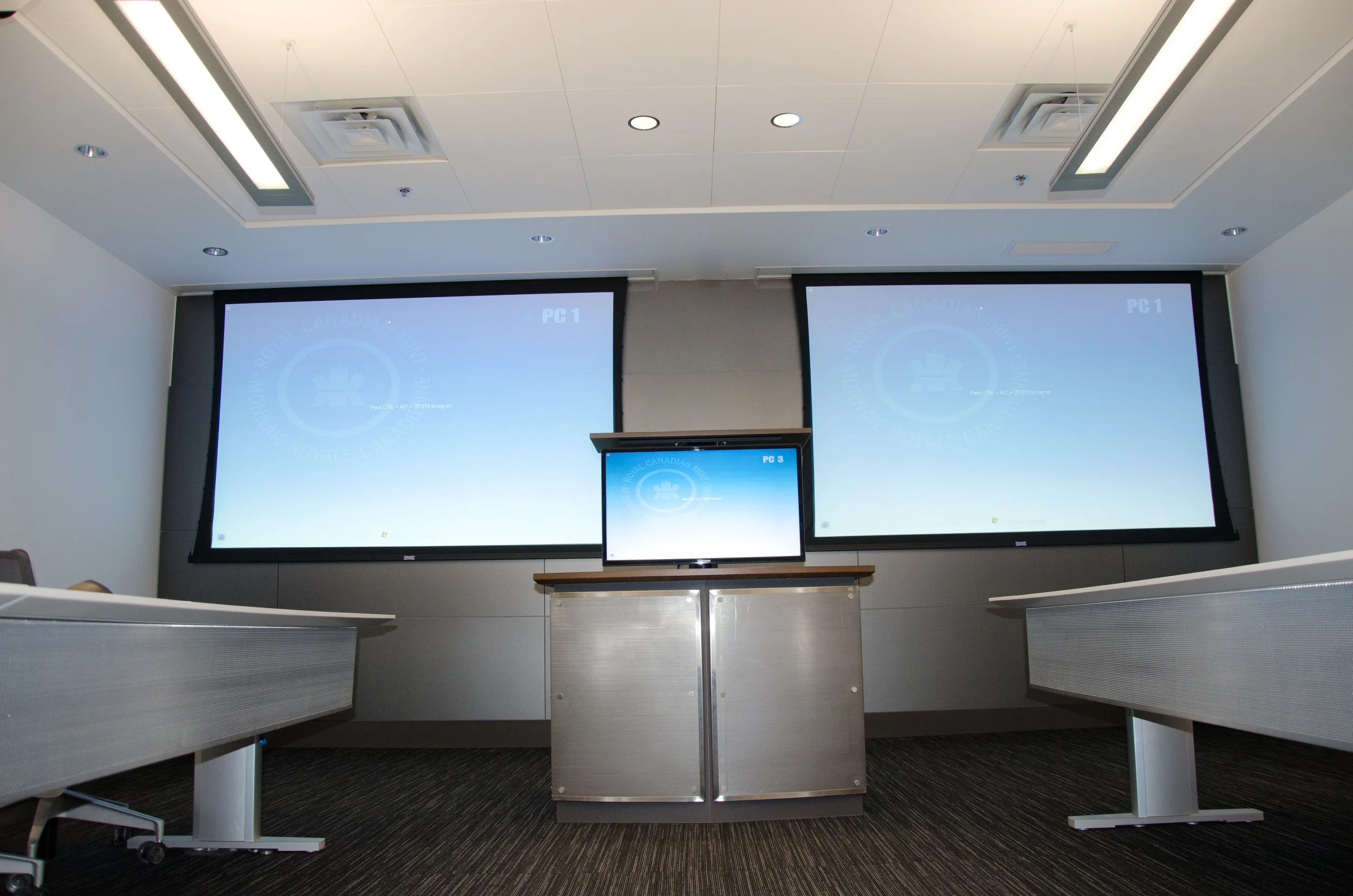  Opposite end of Conference Room allows for dual screens for English and French presentations, as well as video presentations from a speaker anywhere in the world.
