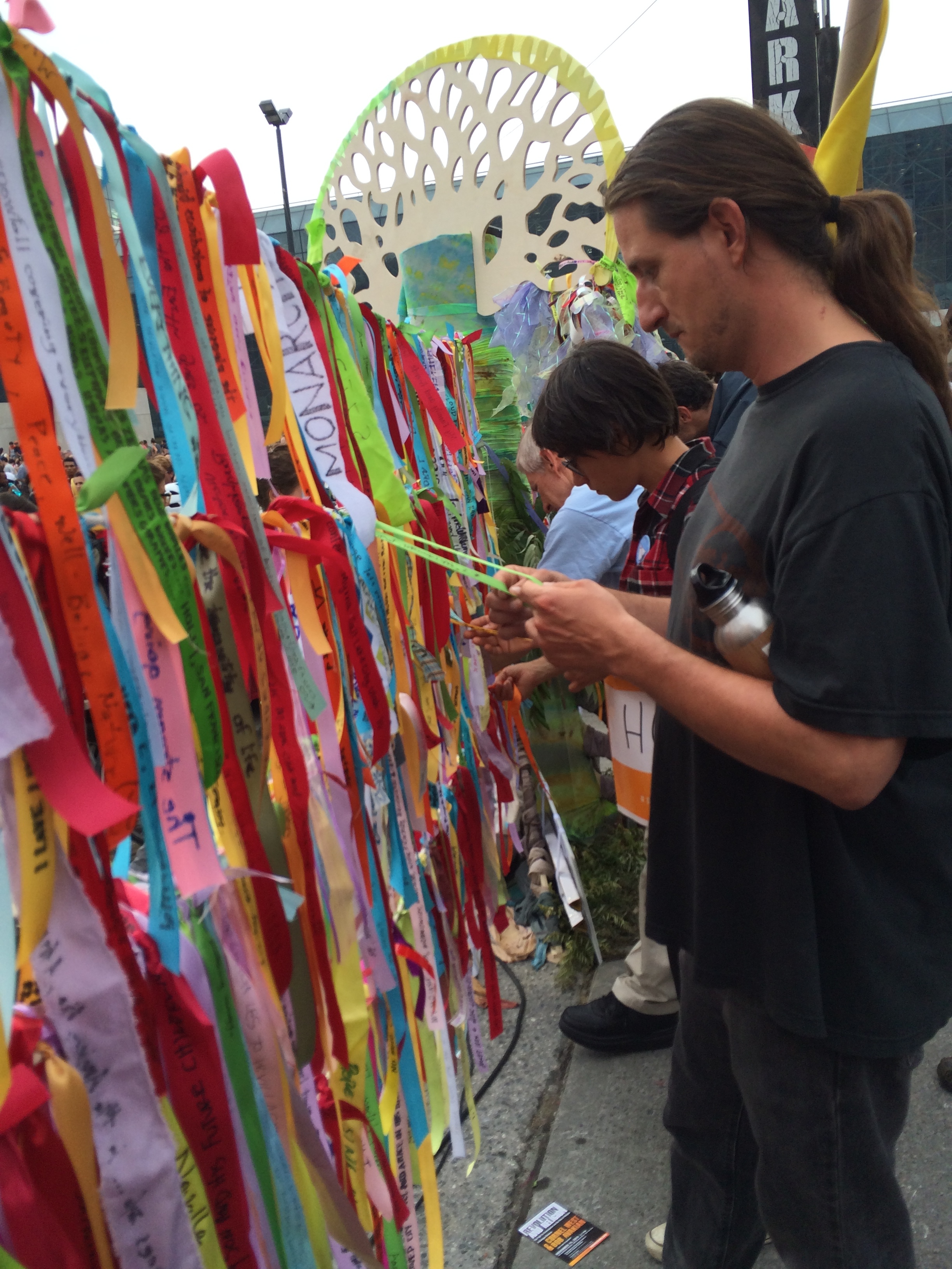 People choosing climate ribbons to take home, Peoples Climate March, NYC