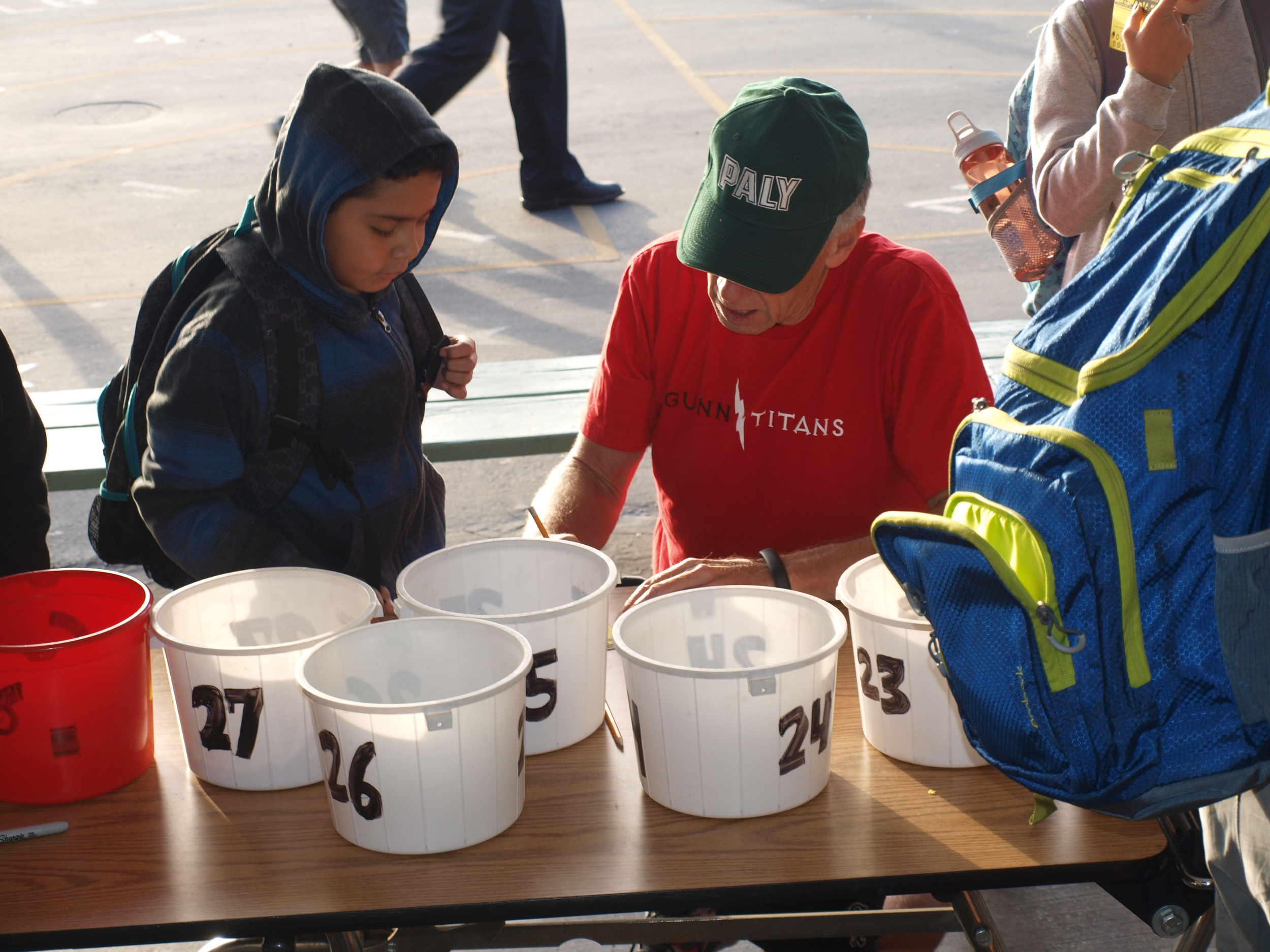 PAUSD Superintendent McGee helps students get their cards punched
