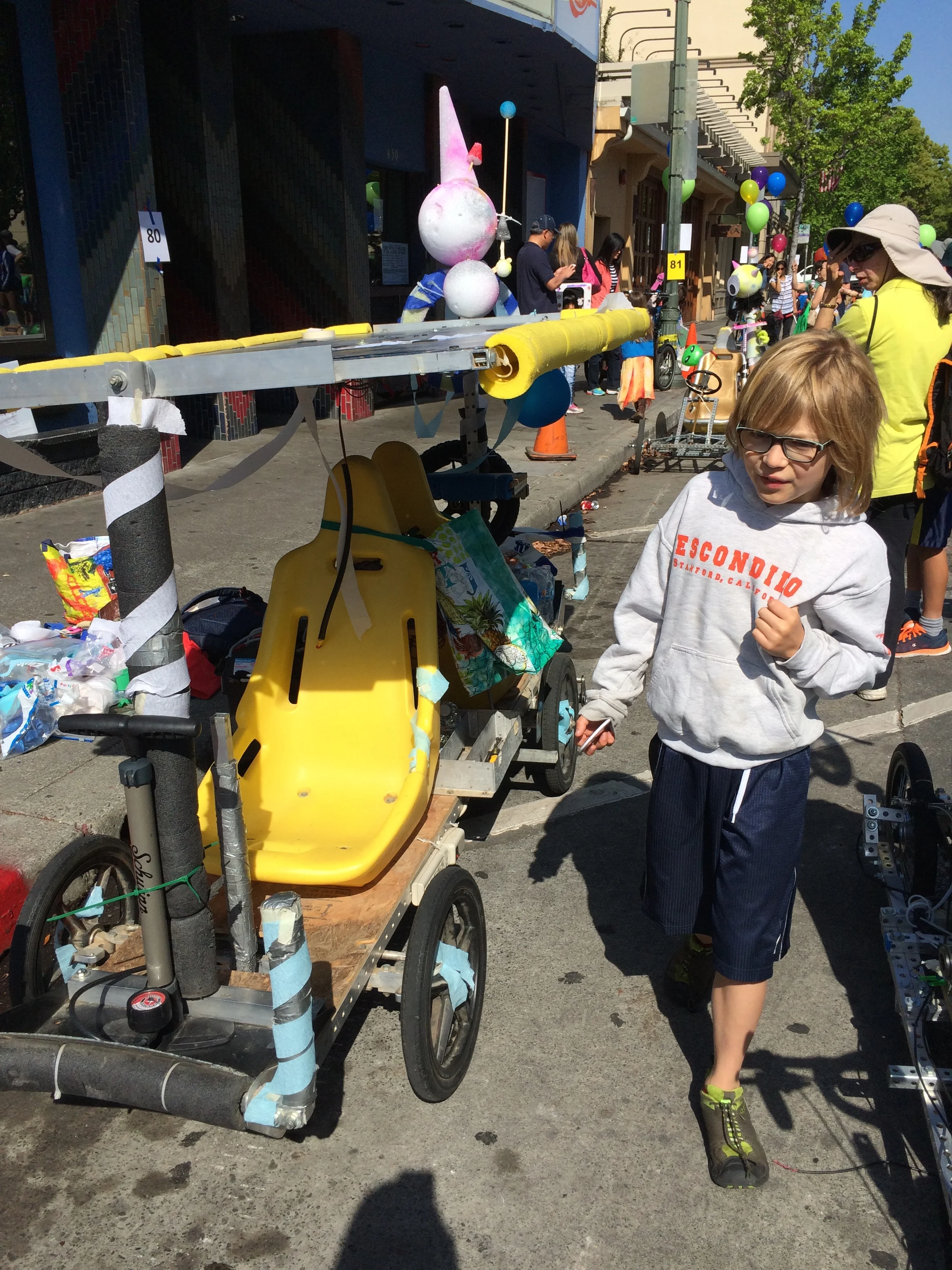 Elliot checks out the solar-powered electric car, built by students at the JLS Jr. High Electric Car Club.