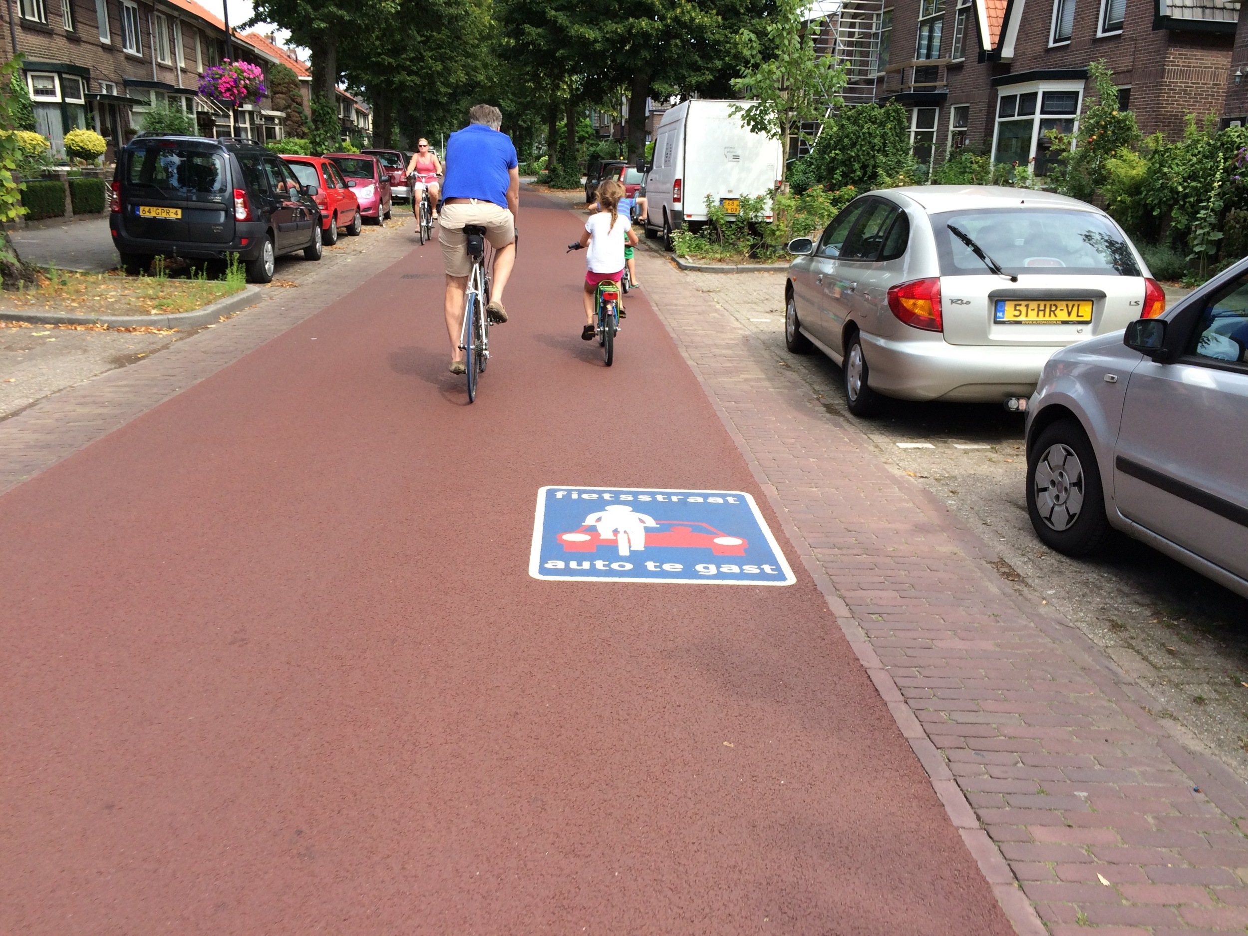 Deventer "bike street". Sign reads "autos are guests".