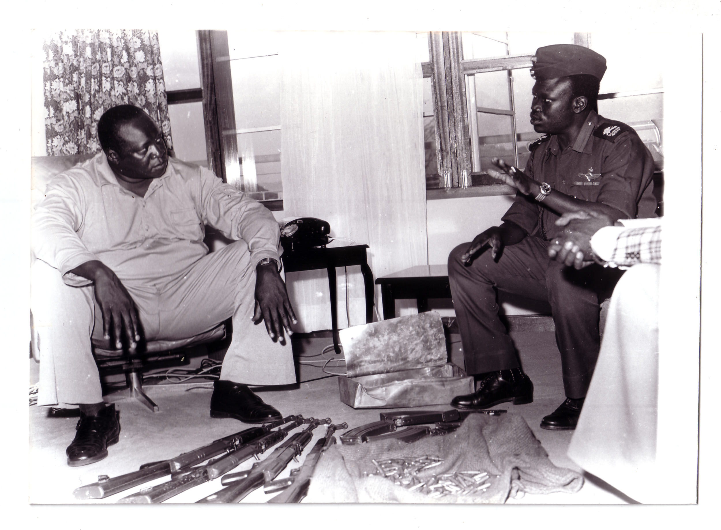  General Idi Amin receives a briefing on subversive activities from his loyal subordinate, Yusuf Gowon. (Radio Uganda)  