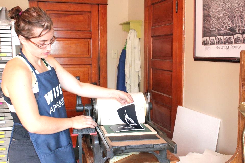 MITCH co-founder and artist helping pull some proofs at MITCH Collective. 