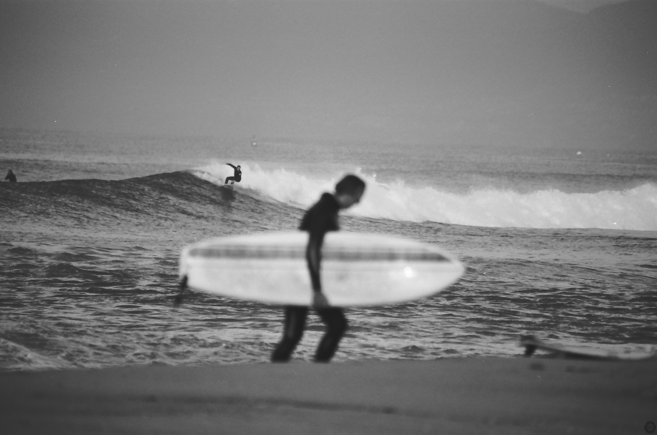 SurferWalkingUpSandElPorto01.jpg
