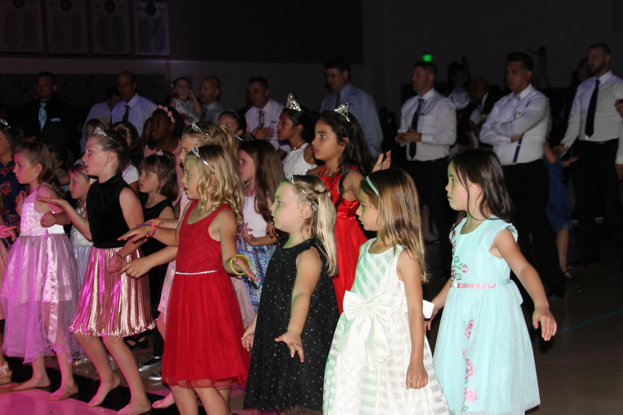 girls dancing at father daughter dance