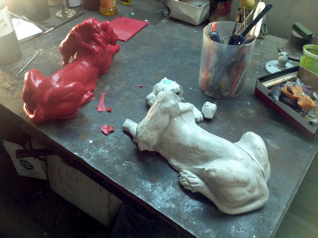The wax copy next to the dried clay original