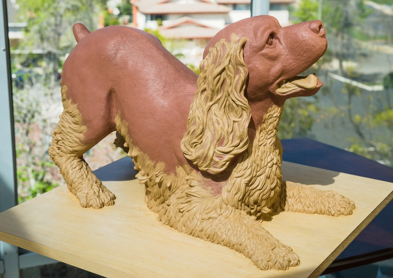 Play Bow. A memorial to our cocker spaniel Sonny. The final clay, ready for bronze. This is a memorial to our cocker spaniel Sonny, in one of his favorite poses, ready to play. He was a wonderful dog. By Terrence Robertson-Fall.