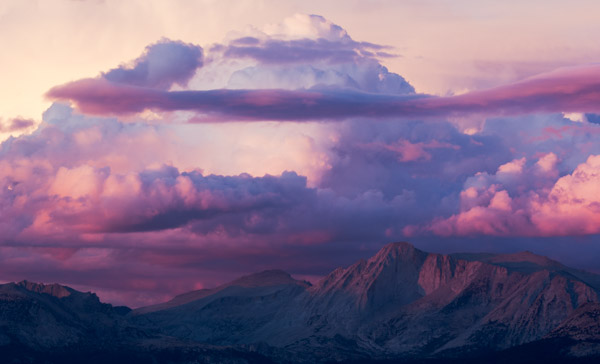 Cotton Candy. Photograph by Terrence Robertson-Fall. Sunset over the High Sierra Mountains in Yosemite National Park. This vantage point is near May Lake, one of the High Sierra Camps for backpackers. The towering yet soft clouds soften the ruggedness of the mountain peaks.