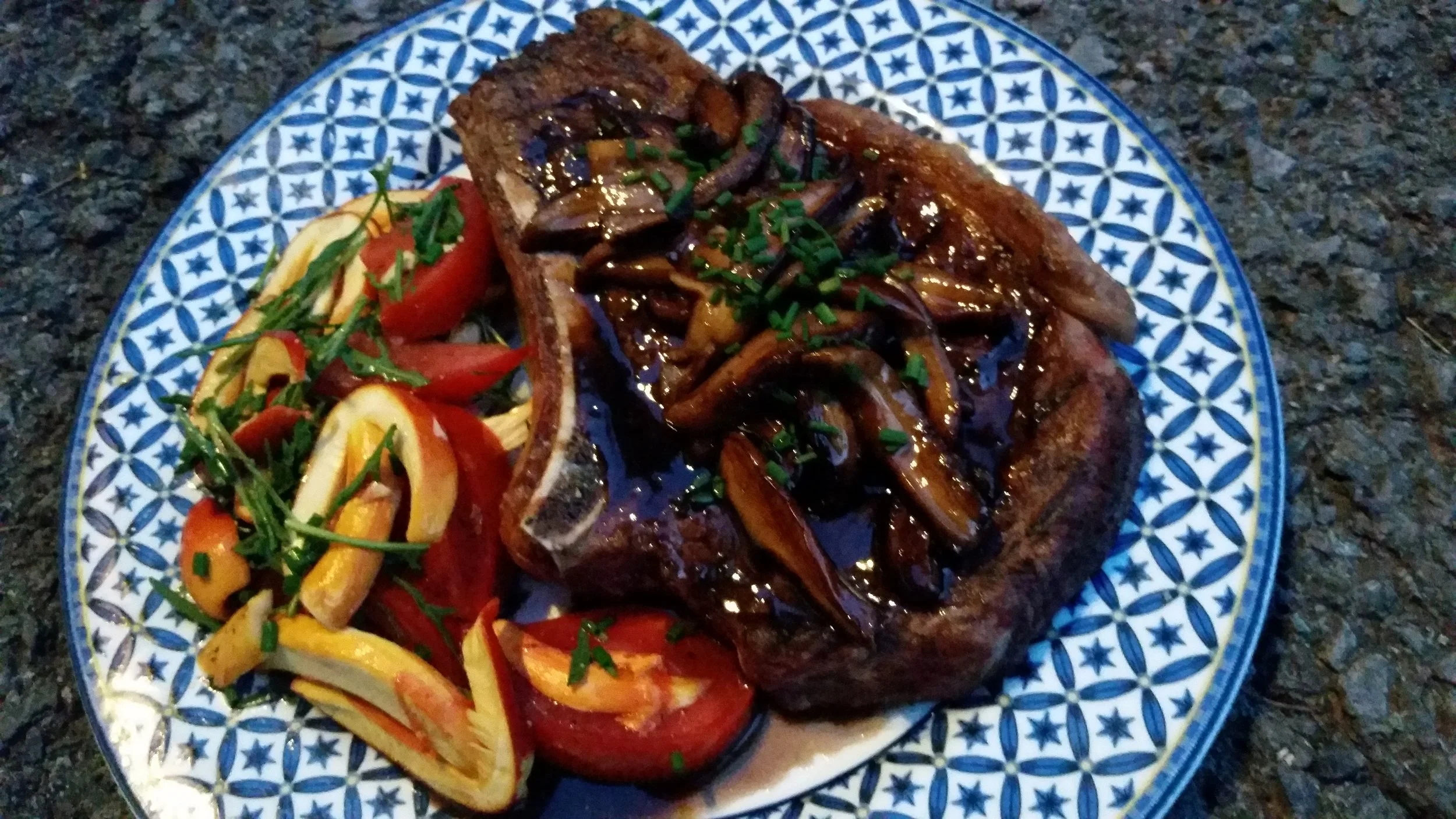 Heather Ridge Farm ribeye with vin de noix glazed porcini, Amanita jacksonii and tomato salad