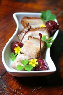crispy pork belly, pickled cherries, wild wood sorrel
