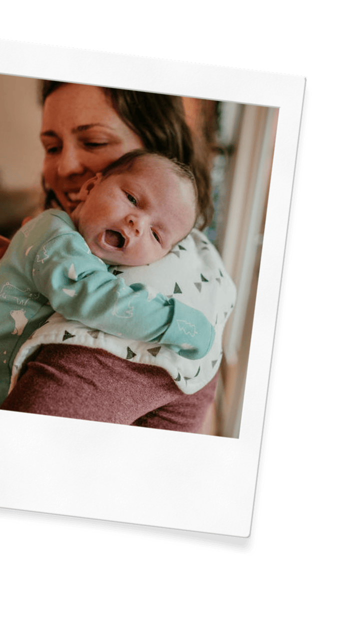 A newborn care specialist and sleep consultant holds a baby in a Hood River home.