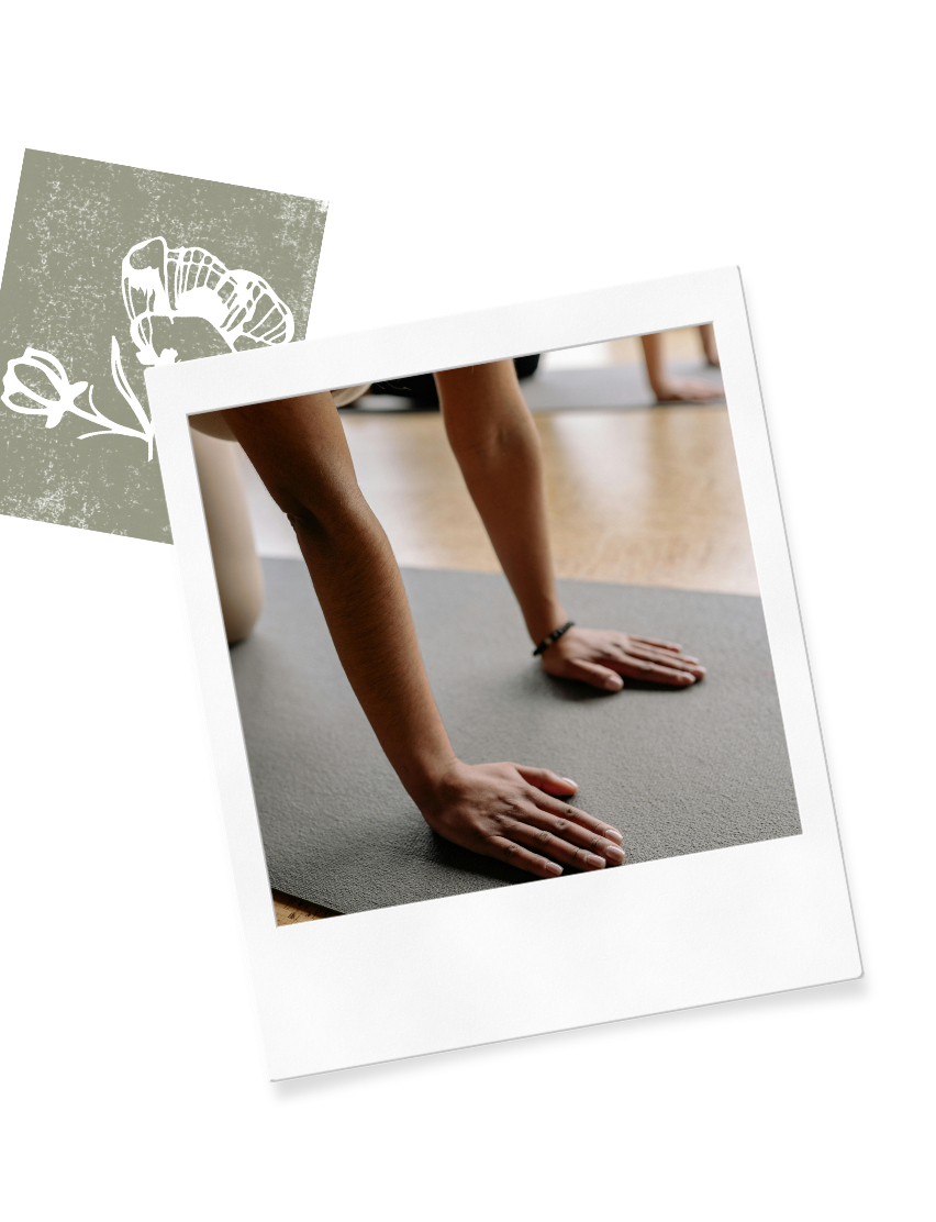 Hand on a yoga mat on the Wildflower Doula Services website.
