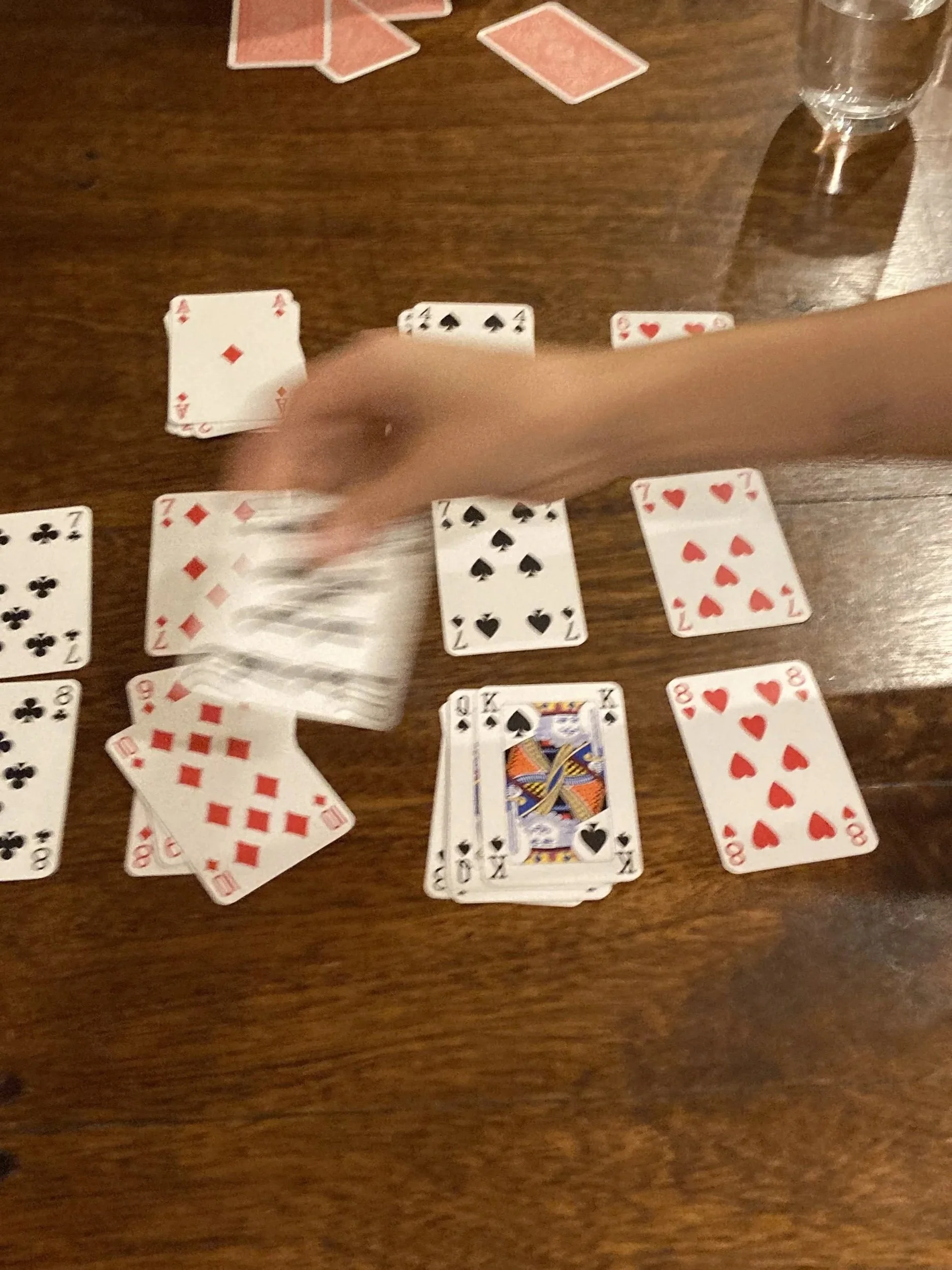 Someone playing cards on the Wildflower Doula Services website.