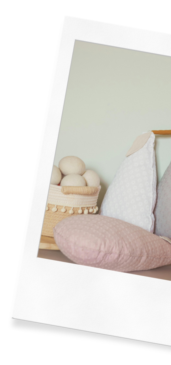 Belonging to a mom using Wildflower Doula Service's newborn care, pillows sit in a Vancouver home's nursery.