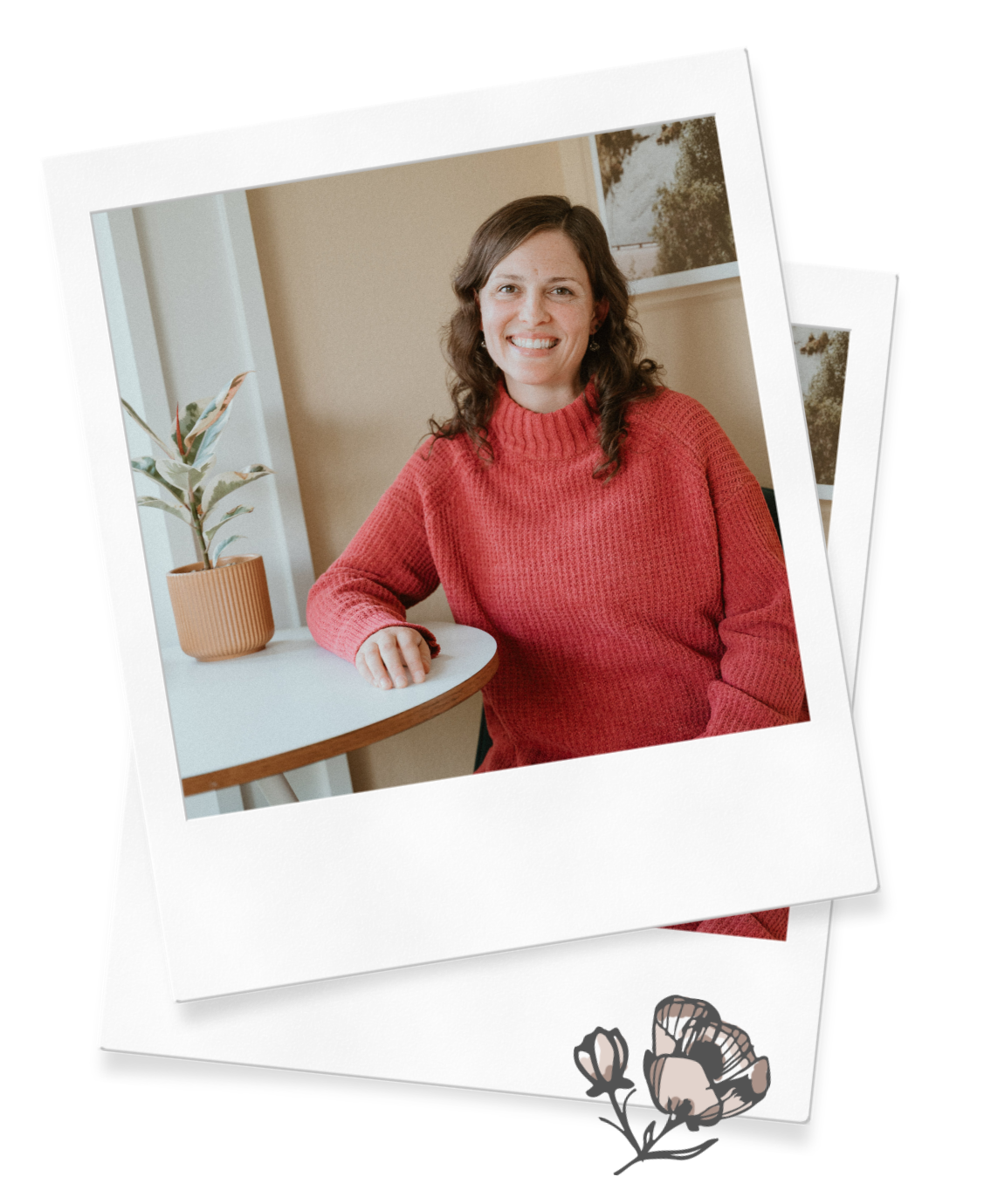Newborn care specialist and postpartum doula Julia-Rose Scianna smiles at a table in a red sweater.