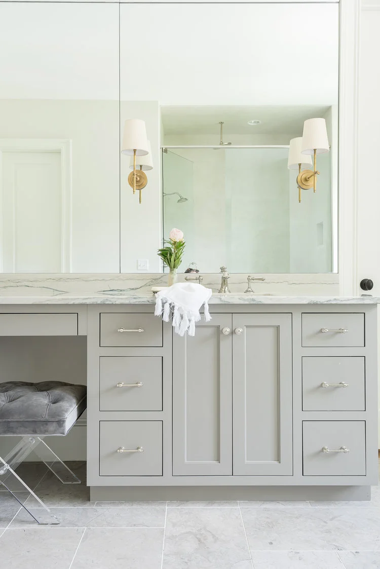 Everything in this bathroom is polished chrome (or nickel - hard to tell), except those sconces, which very subtly say 'hey! the person who lives here is interesting and classy." Photo used courtesy of Parkes & Lamb .