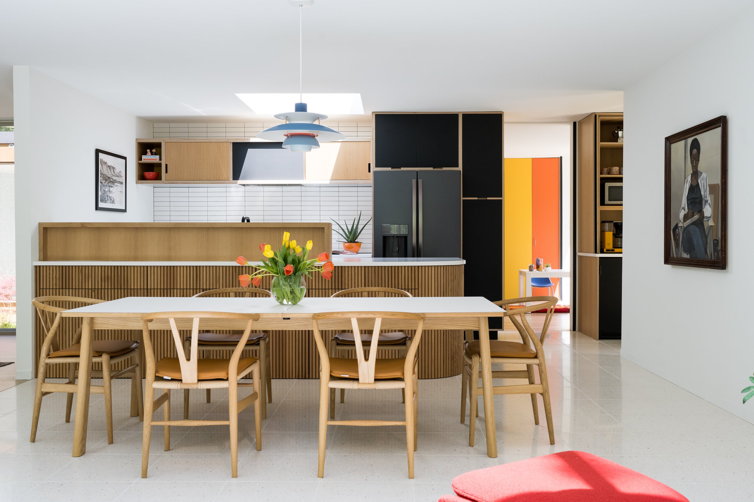 dining-room-full-view-fluted-wood-banquette-open-kitchendining-room-full-view-fluted-wood-banquette-open-kitchen.jpg