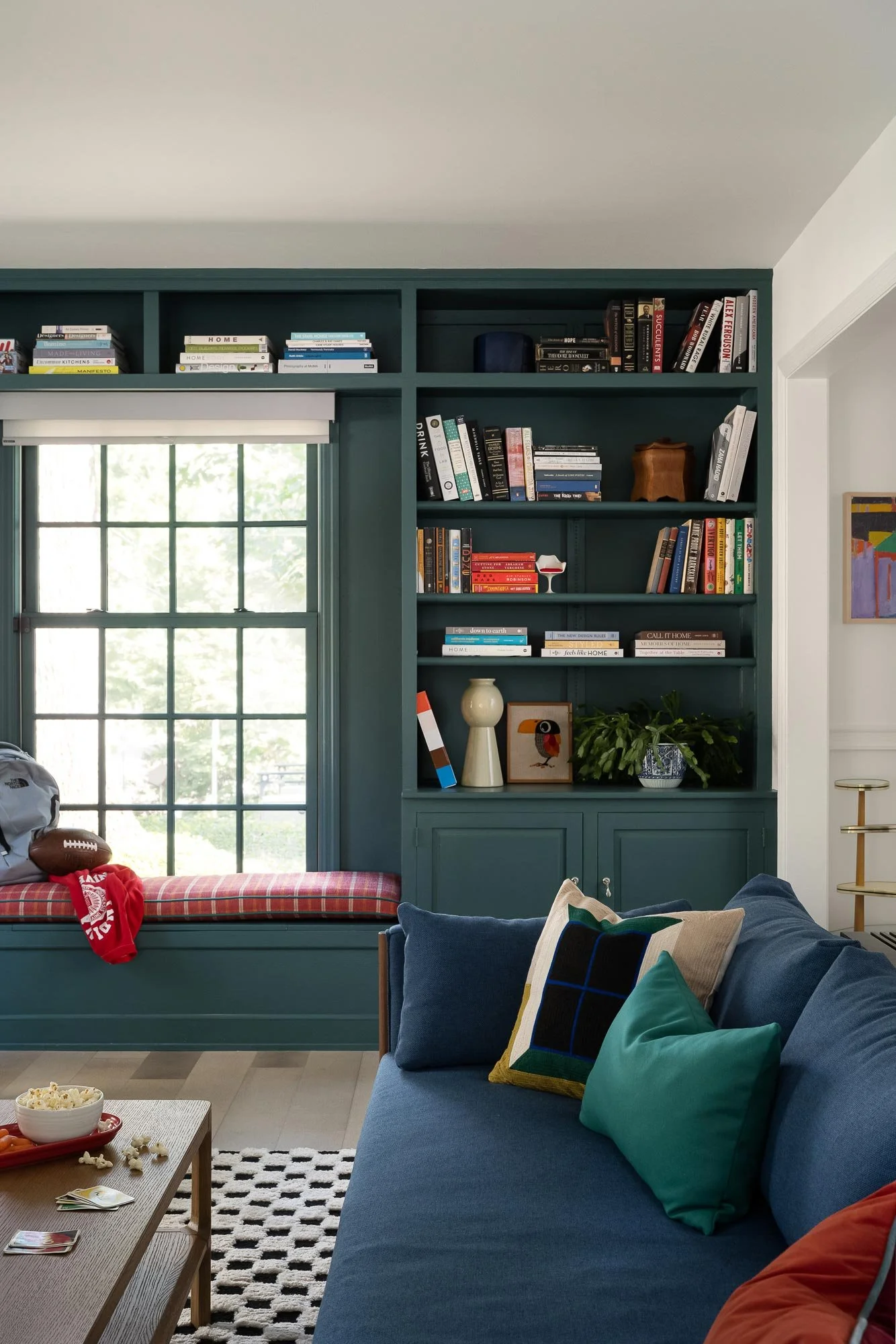 off-campus-canvas-sofa-coffee-table-bookshelves-styled-football.jpg