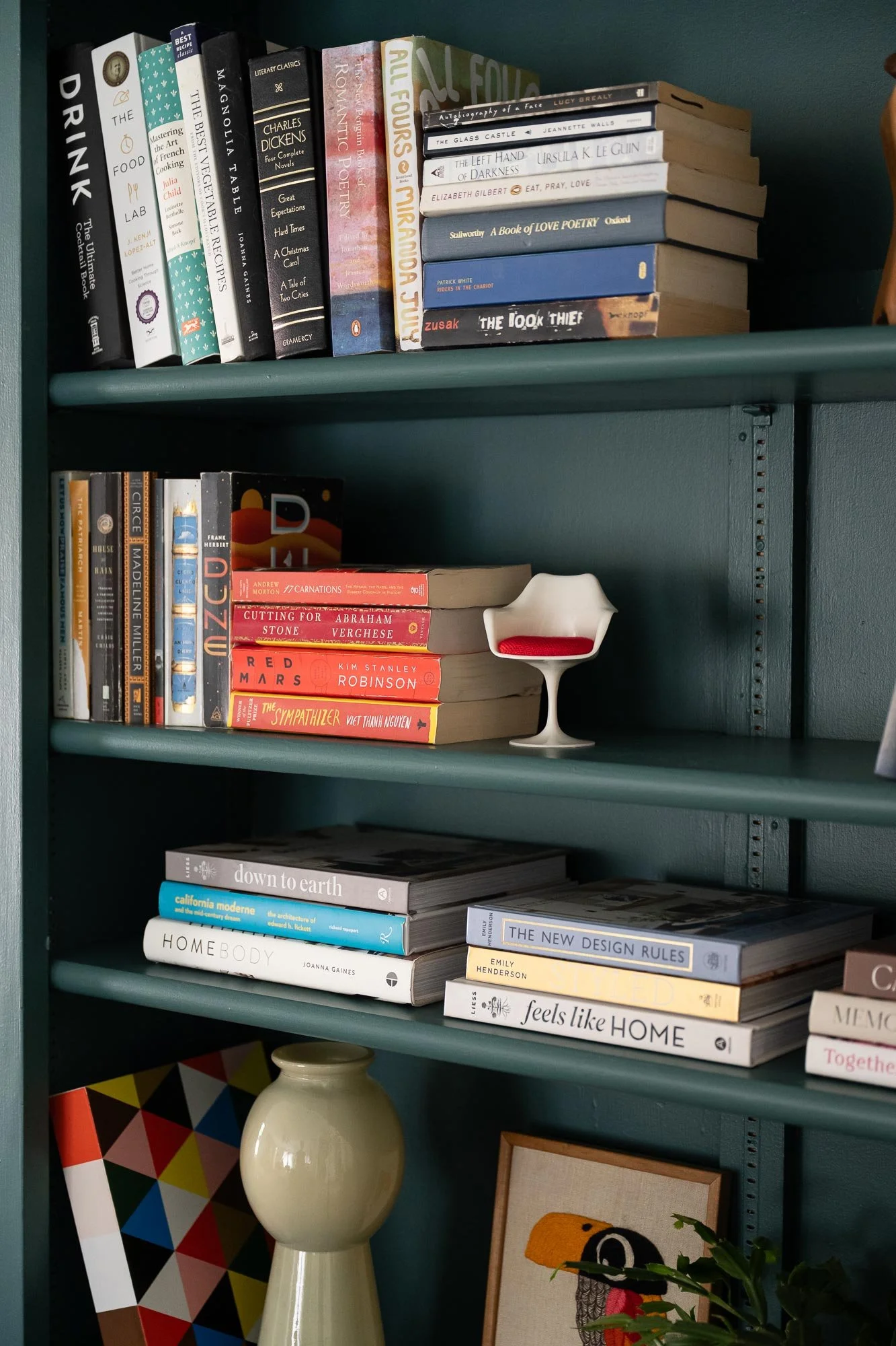 off-campus-canvas-bookshelves-styled-art-tiny-eames-chair-artbooks.jpg