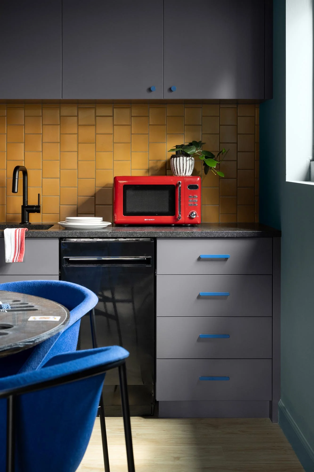 off-campus-canvas-basement-kitchen-yellow-tile.jpg