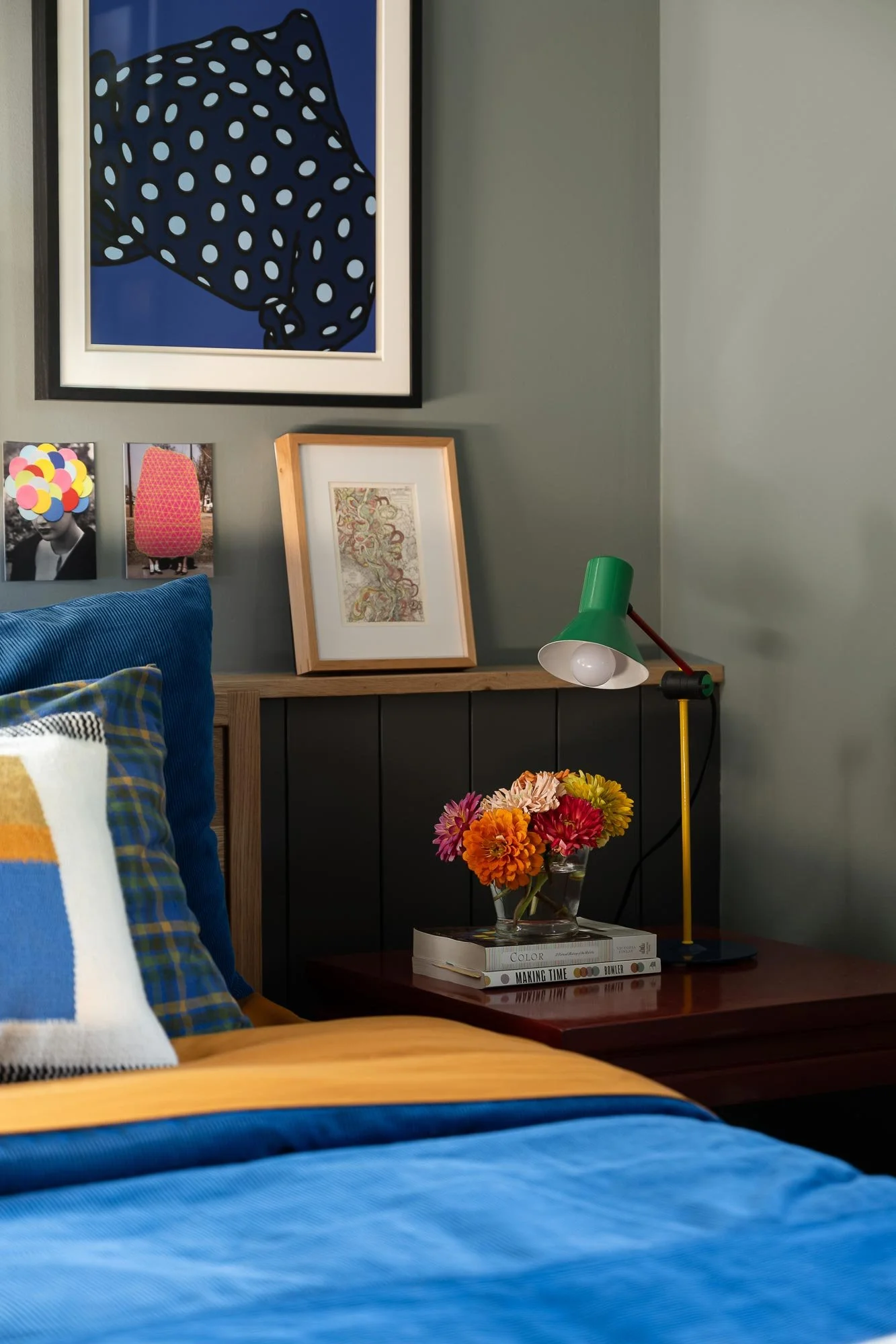 off-campus-canvas-bedroom-blue-lamp-cloeup-books.jpg