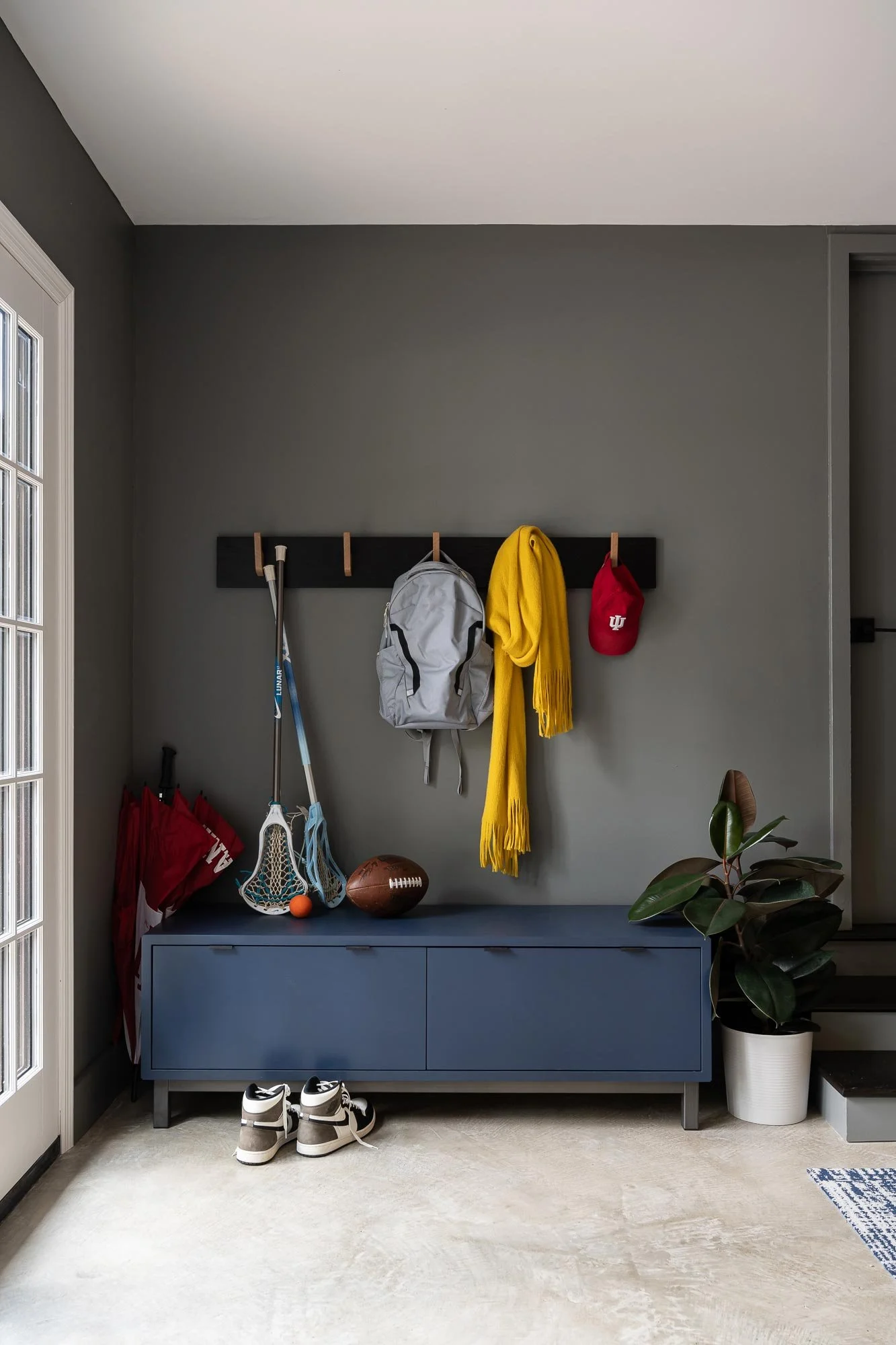 off-campus-canvas-entry-hooks-grey-walls.jpg