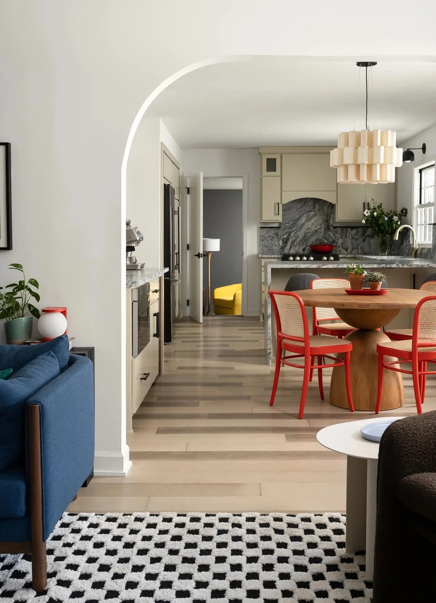 off-campus-canvas-archway-kitchen-wood-table-light-fixture-doorway.jpg